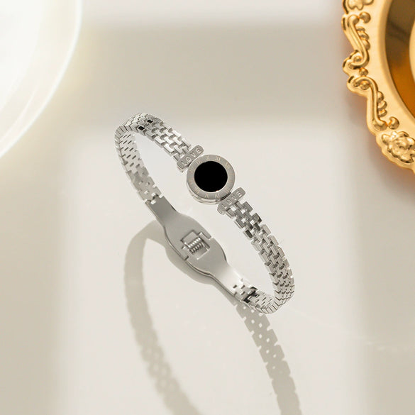 Wholesale Women's Hollow Round Black Shell Stainless Steel And Titanium Steel Bracelet With Electroplating Treatment