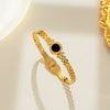 Wholesale Women's Hollow Round Black Shell Stainless Steel And Titanium Steel Bracelet With Electroplating Treatment