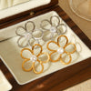 Wholesale Women's Hollow Stainless Steel Geometric Flower Zircon Inlaid Earrings