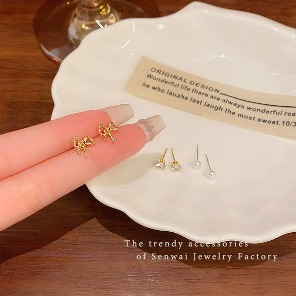 Wholesale Women's Imitation Pearl Bow Tie Earrings With Electroplating