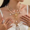 Wholesale Women's Imitation Pearl Tassel Necklace With Alloy Pendant Drop Shape Electroplated Metal Hollow Design