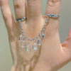 Wholesale Women's Iron Alloy Drop Shape Tassel Chain Finger Ring With Electroplating And Niche Stylish Design