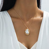 Wholesale Women's Irregularshaped Flower Pattern Pearl Pendant Necklace Made Of Zinc Alloy With Electroplating