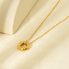 Wholesale Women's 18K Gold Plated Stainless Steel Geometric Necklace With Inlaid Zircon And Hollow Ring Pendant