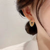 Wholesale Women's Light Luxury Alloy Heart Twist Love Earrings With Gold Plating Electroplating