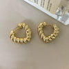 Wholesale Women's Light Luxury Alloy Heart Twist Love Earrings With Gold Plating Electroplating