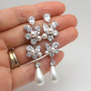 Wholesale Women's Light Luxury Copper Earrings With Imitation Pearl Flower And Leaf Drop Shape And Zircon Design