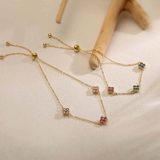 Wholesale Women's Light Luxury Copper Inlaid Colored Diamond Four Leaf Clover Pull Bracelet With Zirconia And Flower Design