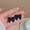 Wholesale Women's Light Luxury Flocking Bow And Heart Zinc Alloy Earrings With Electroplating Treatment