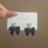 Wholesale Women's Light Luxury Flocking Bow And Heart Zinc Alloy Earrings With Electroplating Treatment