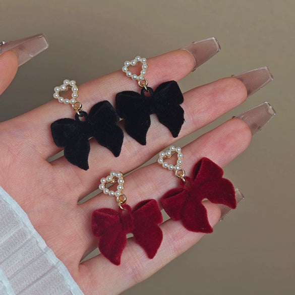 Wholesale Women's Light Luxury Flocking Bow And Heart Zinc Alloy Earrings With Electroplating Treatment