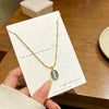 Wholesale Women's Light Luxury Geometric Cat's Eye Stone Titanium Steel Necklace With Zirconia Design And 18K Vacuum Electroplating