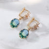 Wholesale Women's Light Luxury Geometric Copper Earrings With Oval Gem And Zircon Inlay And Electroplating Treatment