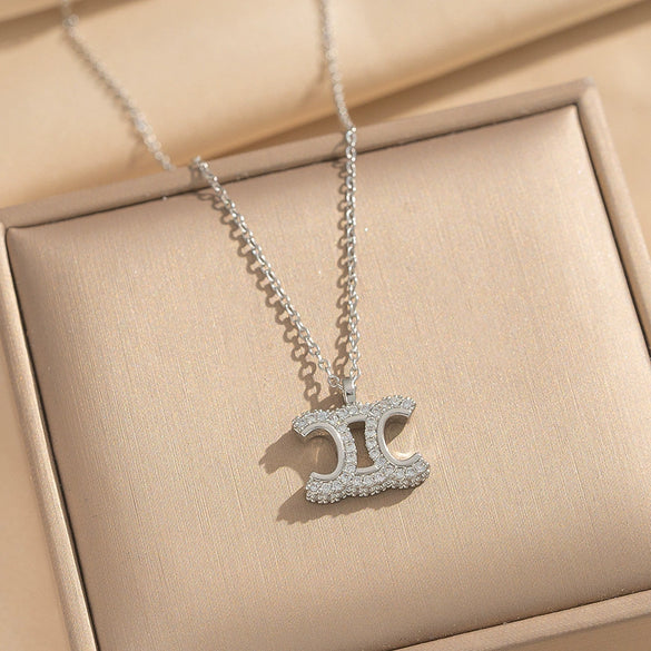 Wholesale Women's Light Luxury Gold Plated Arc De Triomphe Pendant Necklace With Copper Inlaid Zircon And Titanium Steel O Word Chain