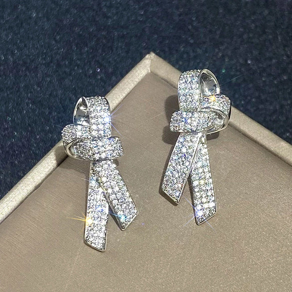 Wholesale Women's Light Luxury Style Copper Earrings With Microinlaid Zircon And Bow Tie Geometric Design