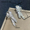 Wholesale Women's Light Luxury Style Copper Earrings With Microinlaid Zircon And Bow Tie Geometric Design