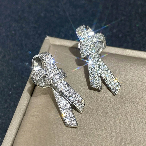 Wholesale Women's Light Luxury Style Copper Earrings With Microinlaid Zircon And Bow Tie Geometric Design