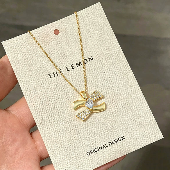 Wholesale Women's Light Luxury Titanium Steel Necklace With Oshaped Chain And Copper Zirconinlaid Letter Heart Pendant