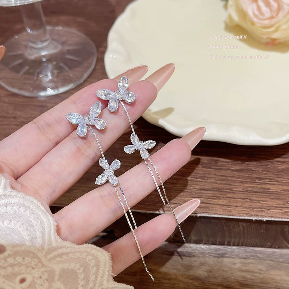 Wholesale Women's Light Luxury Ultraflash Long Copper Zircon Butterfly Tassel Earrings With Bow And Geometric Patterns And Animal Style