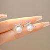 Wholesale Women's Light Luxury Zinc Alloy Rhinestone Bow Pearl Earrings With Electroplating