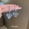 Wholesale Women's Light Luxury Zircon Inlaid Dropshaped Tassel Earrings