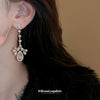 Wholesale Women's Light Luxury Zircon Inlaid Dropshaped Tassel Earrings