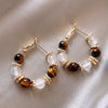 Wholesale Women's Maillard Style Alloy Geometric Tiger Eye Earrings With Electroplating