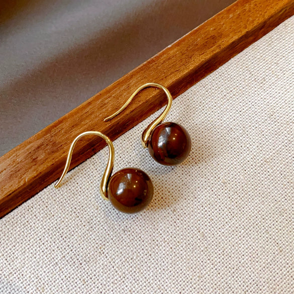 Wholesale Women's Maillard Style Alloy Geometric Tiger Eye Earrings With Electroplating