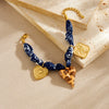 Wholesale Women's Maillard Style Dark Blue Leopard Print Stainless Steel Goldplated Heartshaped Embossed Pendant Bracelet