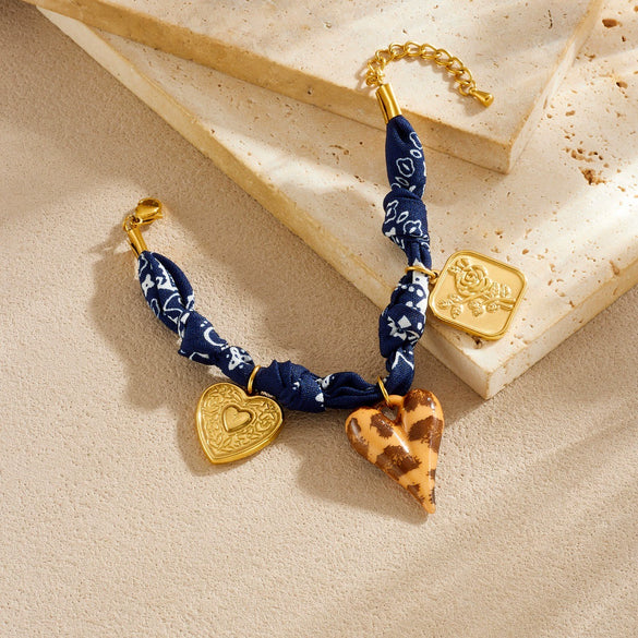 Wholesale Women's Maillard Style Dark Blue Leopard Print Stainless Steel Goldplated Heartshaped Embossed Pendant Bracelet