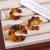 Wholesale Women's Maillard Style Geometric Leopardprint Resin Cshaped Electroplated Ear Clips