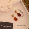 Wholesale Women's Maillard Style Geometric Tiger Eye Real Gold Plated Titanium Steel Earrings