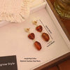 Wholesale Women's Maillard Style Geometric Tiger Eye Real Gold Plated Titanium Steel Earrings