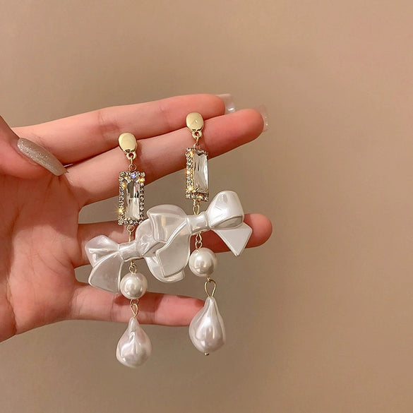 Wholesale Women's Metal Electroplated Bow Shape Pearl Tassel Earrings Light Luxury Style