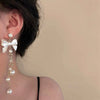 Wholesale Women's Metal Electroplated Bow Shape Pearl Tassel Earrings Light Luxury Style