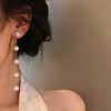 Wholesale Women's Metal Electroplated Bow Shape Pearl Tassel Earrings Light Luxury Style
