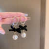 Wholesale Women's Metal Electroplated Bow Shape Pearl Tassel Earrings Light Luxury Style