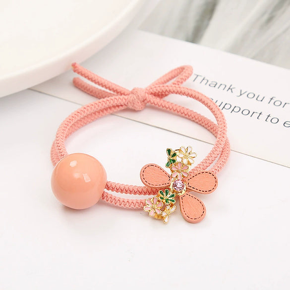 Wholesale Women's Metal Hair Rubber Band With Camellia Design And Electroplating Treatment