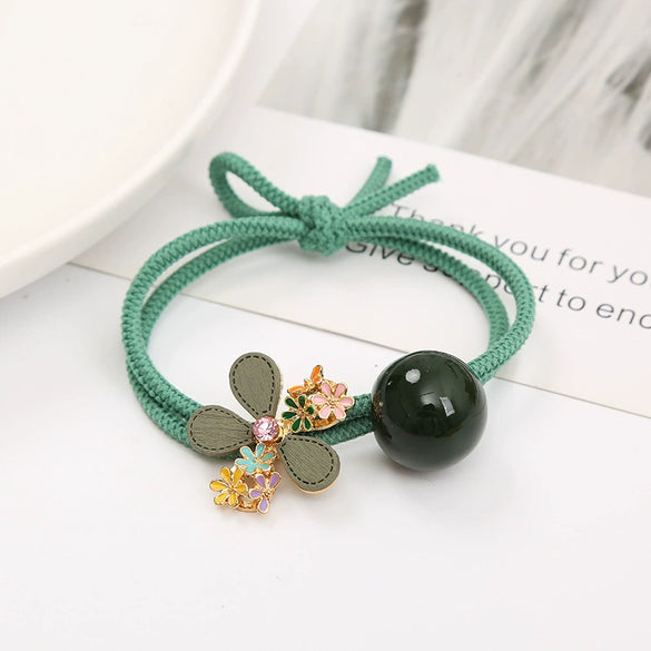 Wholesale Women's Metal Hair Rubber Band With Camellia Design And Electroplating Treatment