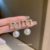 Wholesale Women's Metal Letter Earrings With 925 Silver Needles And Electroplating Simple Style
