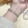 Wholesale Women's Minimalist Light Luxury Brass Microinlaid Fourpetal Flower Bracelet