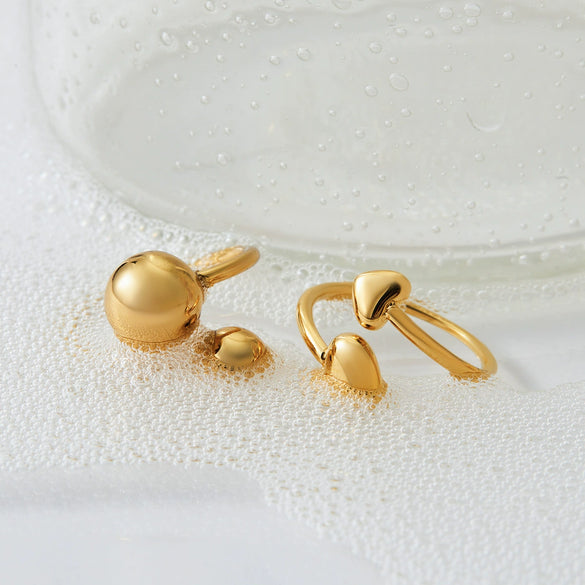 Wholesale Women's Minimalist Stainless Steel Hollow Love Ball Ring With Double Heart Open Design And Electroplating