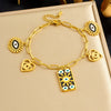 Wholesale Women's Personality Trend Goldplated Stainless Steel Heart Water Drop Bell Pattern Cut Out Pendant Jewelry Set With Cross Chain