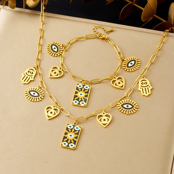 Wholesale Women's Personality Trend Goldplated Stainless Steel Heart Water Drop Bell Pattern Cut Out Pendant Jewelry Set With Cross Chain