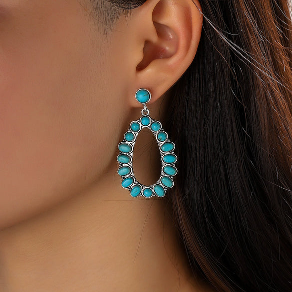 Wholesale Women's Retro Cartoon Drop Shape Hollow Inlaid Turquoise Alloy Earrings