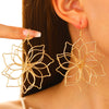 Wholesale Women's Retro Exaggerated Metal Hollow Flower Geometric Woven Earrings With Electroplating