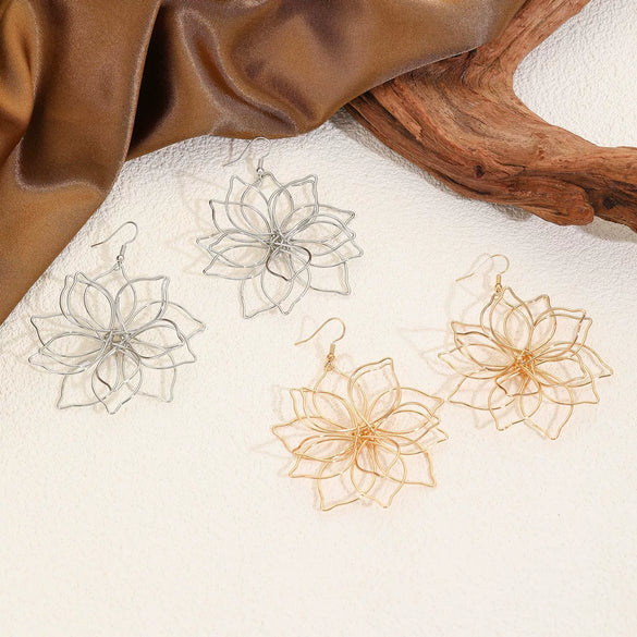 Wholesale Women's Retro Exaggerated Metal Hollow Flower Geometric Woven Earrings With Electroplating