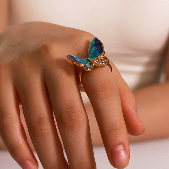 Wholesale Women's Retro Light Luxury Ring In Blue Purple Oil Drop With Diamond Butterfly Design Made Of Stainless Steel With 18K Furnace Vacuum Plating