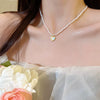 Wholesale Women's Retro Pearl Clavicle Chain Necklace Copper Geometric Heart Bow Electroplated