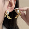 Wholesale Women's Retro Pearl Leaf Titanium Steel Earrings With Flower Pattern And Electroplating